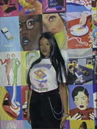 Biankeye Designs The Break SS25 graphic T-shirt, photographed against an artwork display