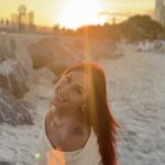 Icielani in her artist-supplied beach portrait at sunset.