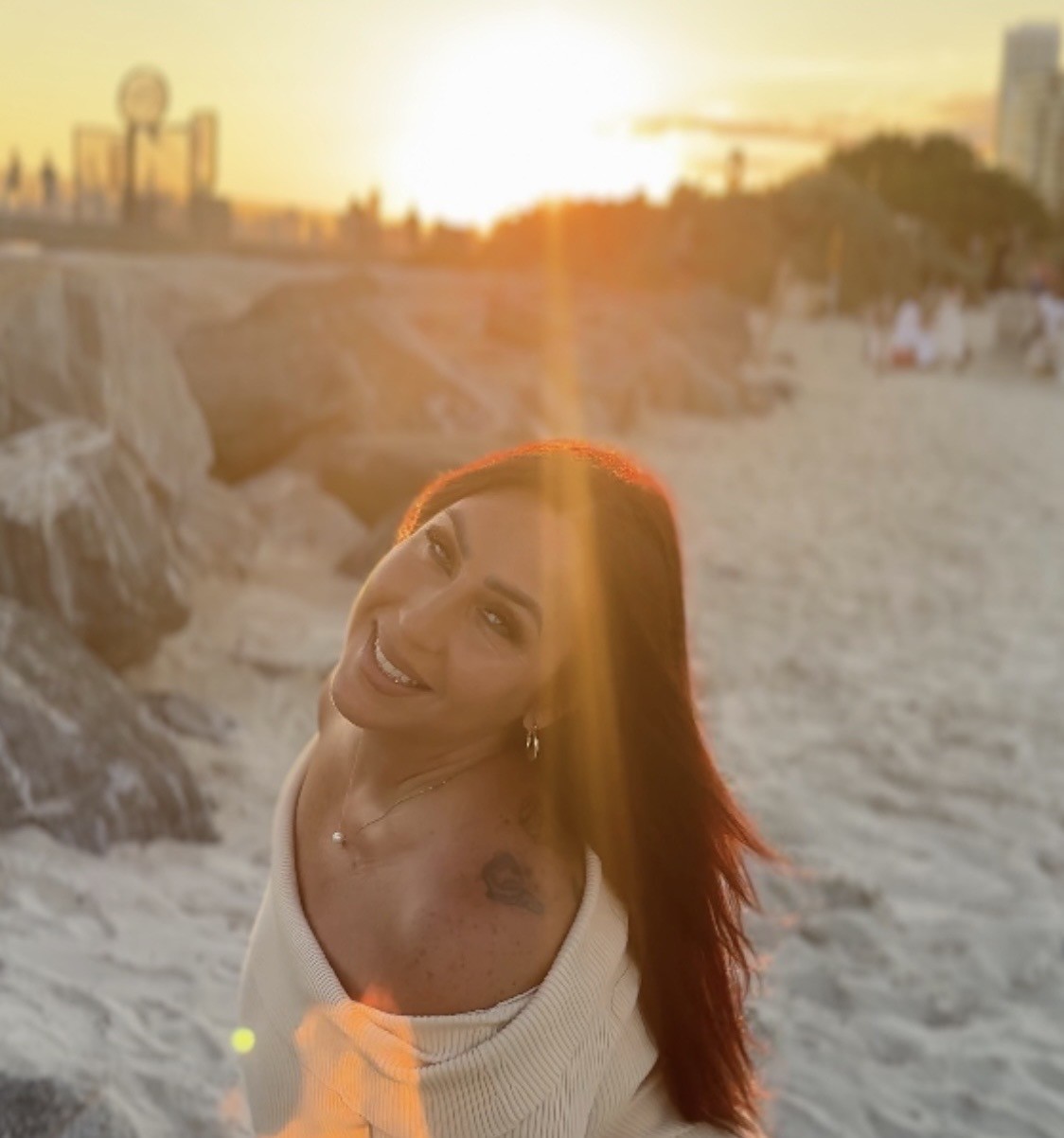 Icielani in her artist-supplied beach portrait at sunset.
